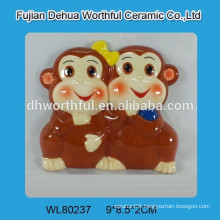 Ceramic souvenir fridge magnet with monkey figurine